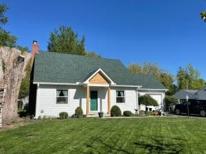 A front view of the after photo for a home in Lebanon, OH that recieved new James Hardie siding and trim, cedar accents, and a new roof from EMA Construction