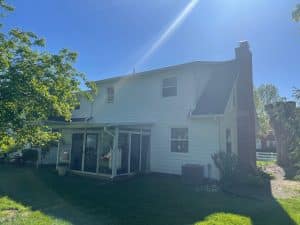 A rear view of the after photo for a home in Lebanon, OH that recieved new James Hardie siding and trim, cedar accents, and a new roof from EMA Construction