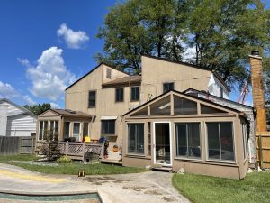 Before picture of old wood siding that will be replaced with James Hardie siding and trim.