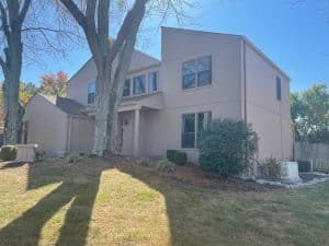 Side view of a Cincinnati area home that just recieved James Hardie siding and trim and will be getting it painted soon